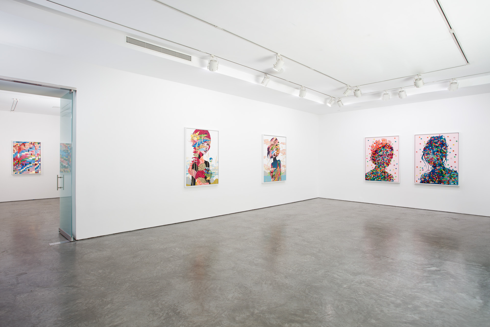 Art catalog open to spread of two woven textile works with fringe